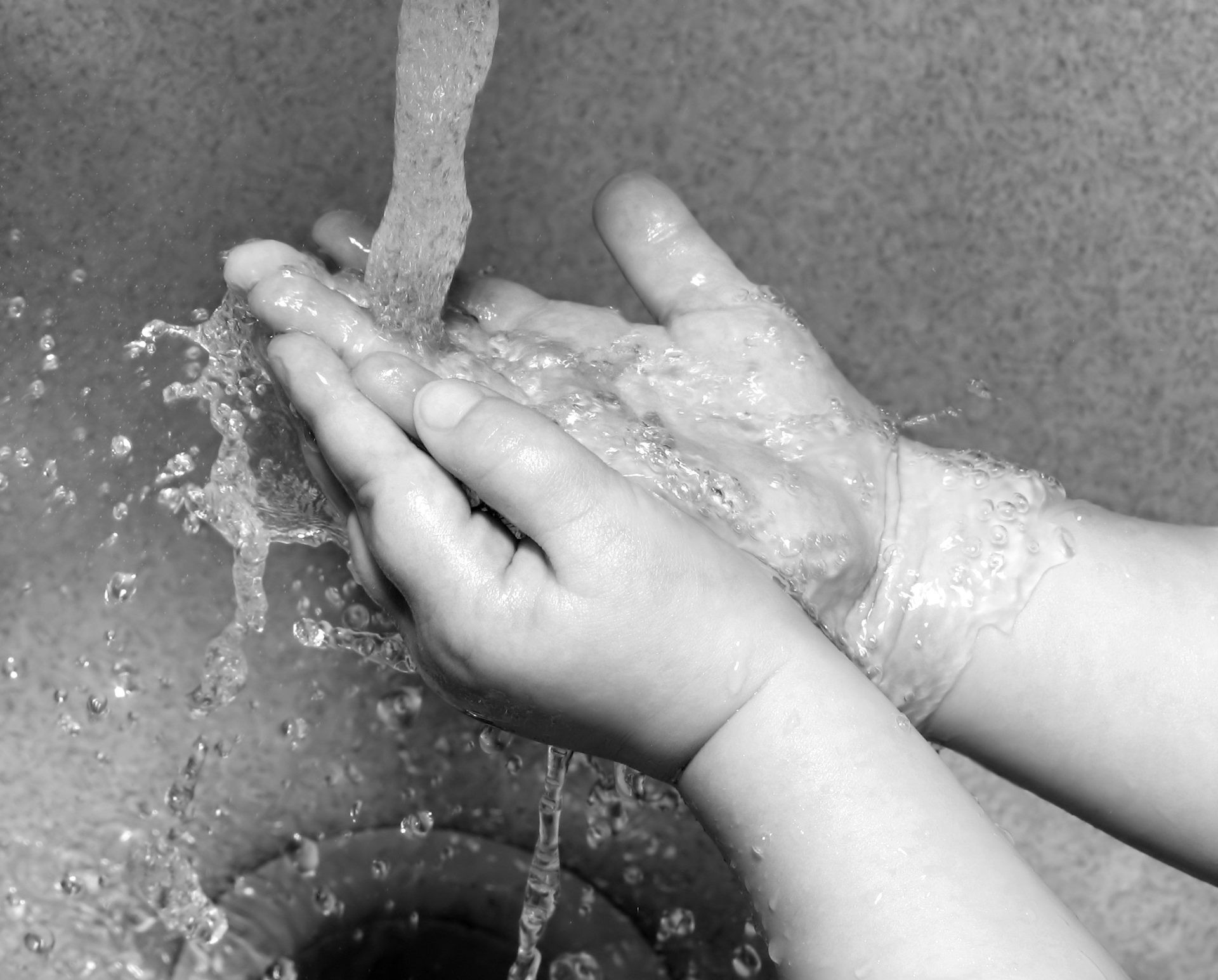 Child Washing Hands at Sink