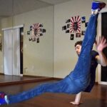 Breakdancer performing a flare, showcasing skill and flexibility