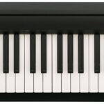 Fingers playing a keyboard with a focus on correct hand posture and curved fingers, illustrating fundamental piano technique.
