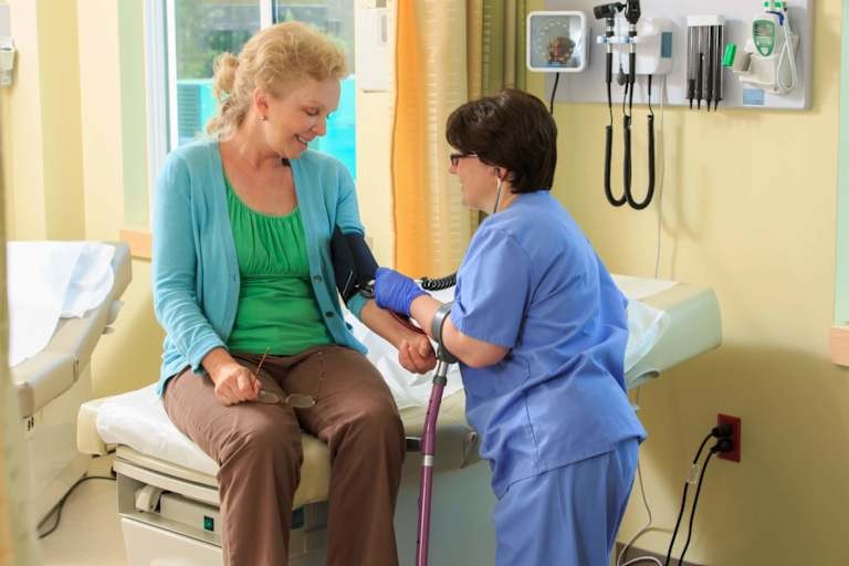 Nurse using a tablet, representing assistive technology in nursing