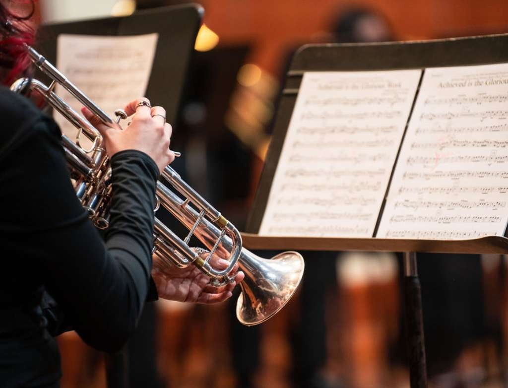 Trumpet student focused on sheet music