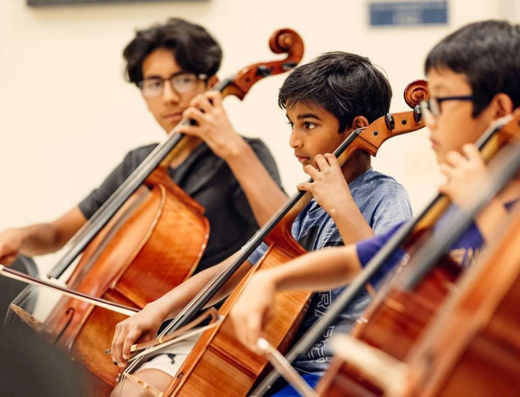 Cello students coordinating their timing