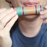 Holding the bamboo flute