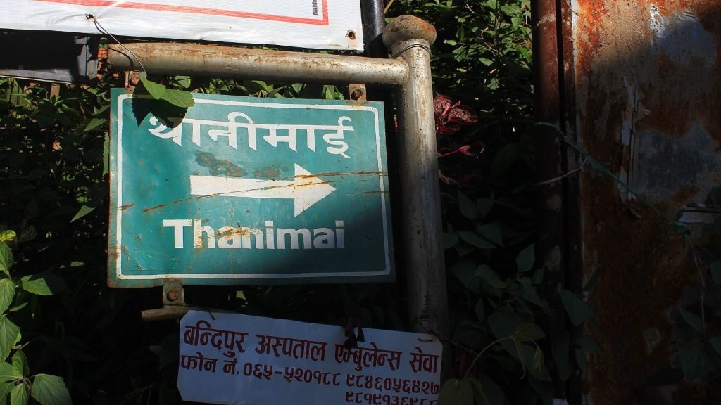 Devanagari script in Bandipur showcasing Nepali words and Roman alphabet.