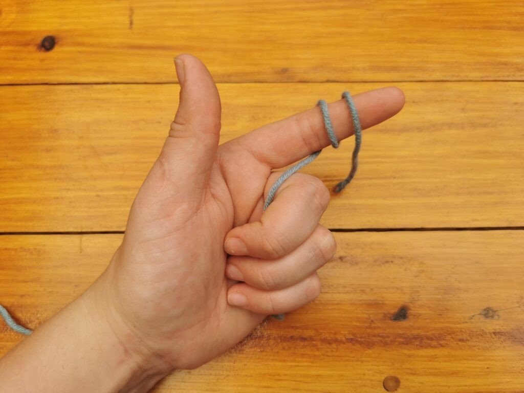 Wrap the yarn around your finer once again, so that you have two loops around your finger.