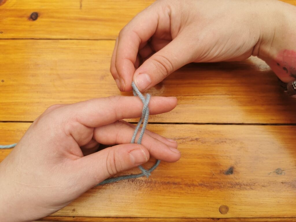 Now take the back loop.