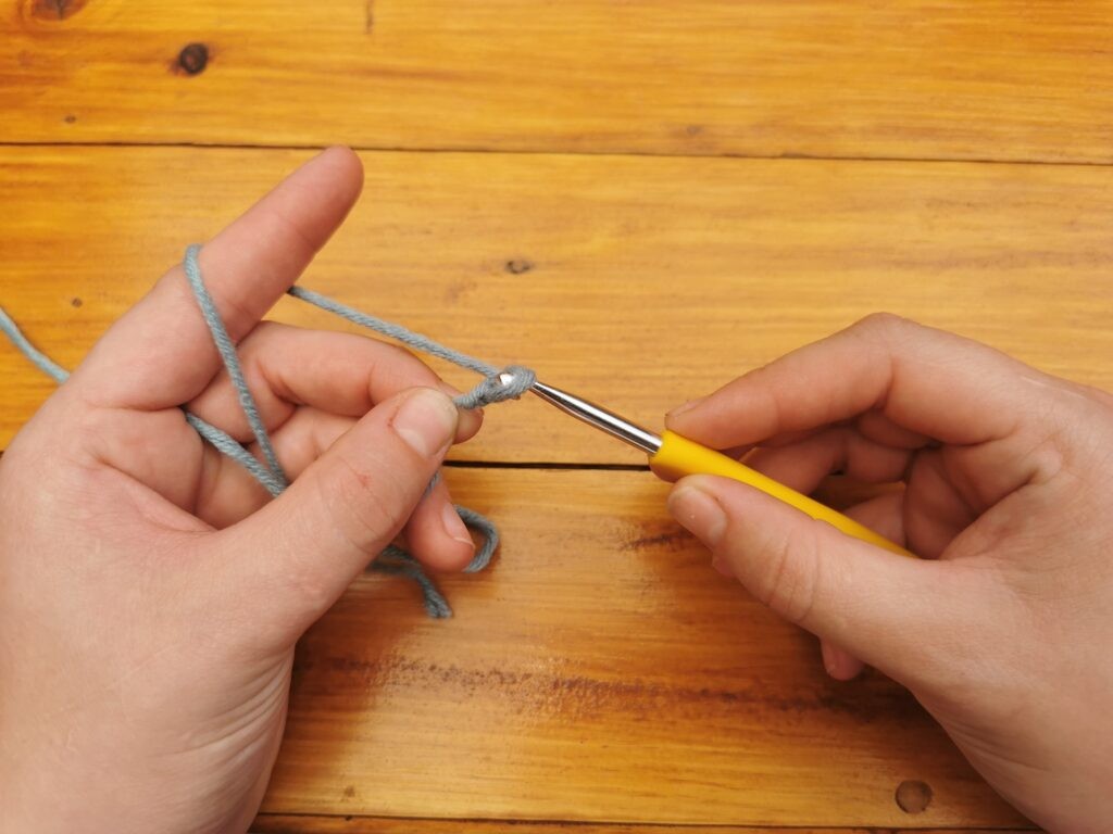 Pull it through the loop on your hook