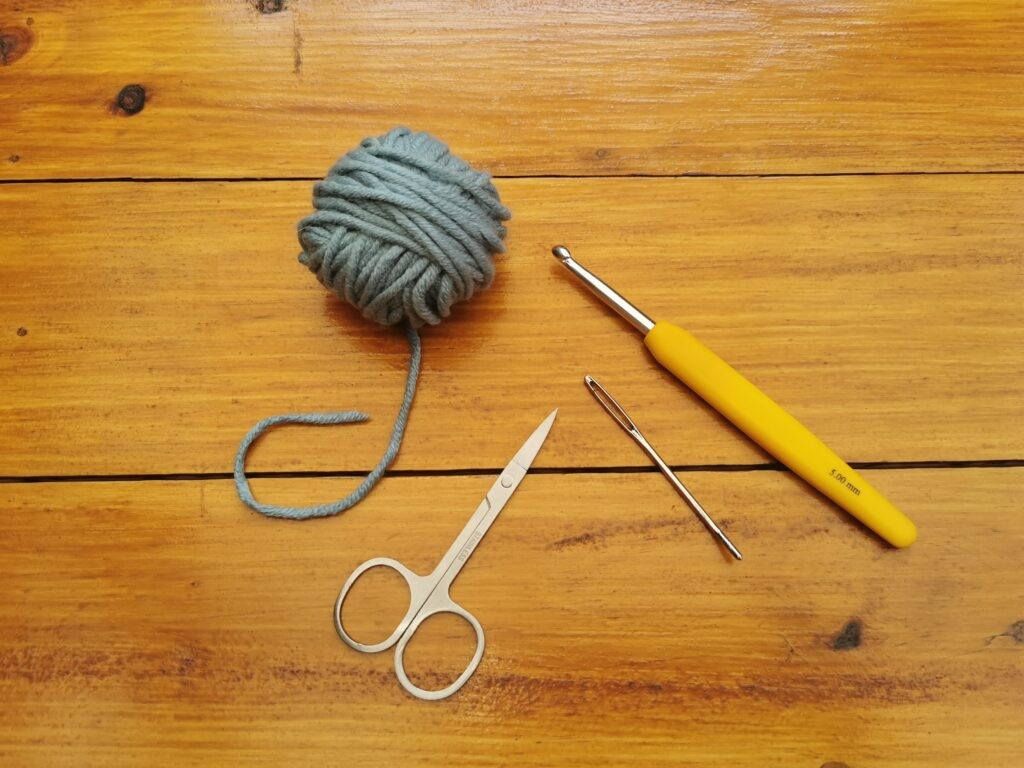 What you will need to start crocheting. Yarn, a hook, a darning needle and scissors