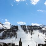 Adult learning to ski in winter