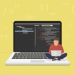 A young girl happily coding on a laptop, showcasing that age is not a barrier to learning programming.