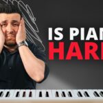 Piano keys close-up, focus on hand position