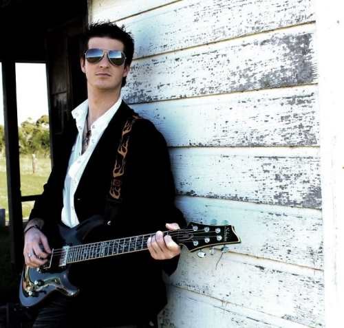 Guitar player performing chord changes