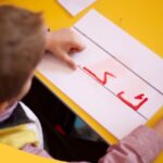 Is Urdu Hard To Learn A Child Has Written Urdu Alphabet On A Paper