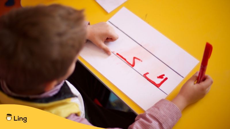 Is Urdu Hard To Learn A Child Has Written Urdu Alphabet On A Paper