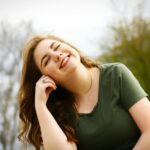 Worried woman sitting on bed