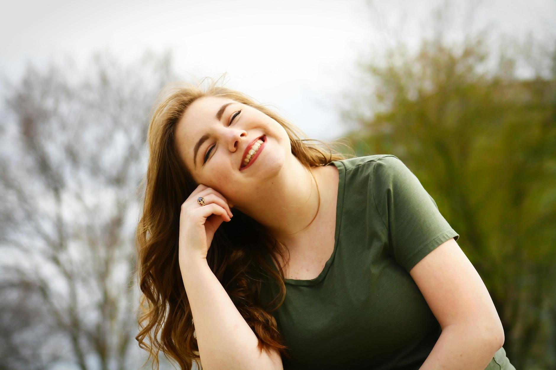 Worried woman sitting on bed