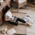 A person in a library surrounded by French books, looking for learning material