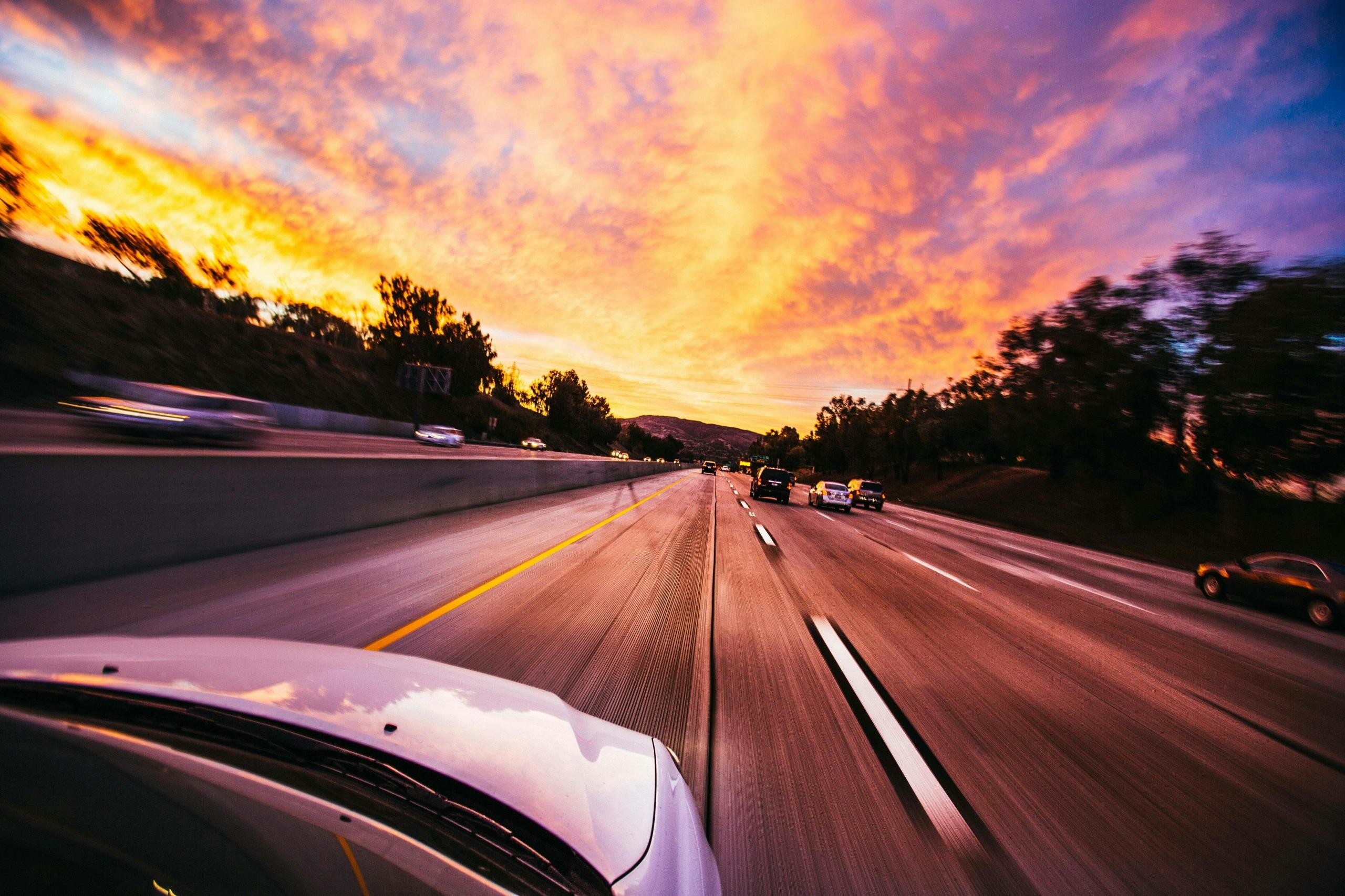 A car driving down the road after getting a license