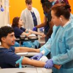 Phlebotomist preparing for blood draw