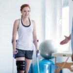 Man walking with crutches during rehabilitation