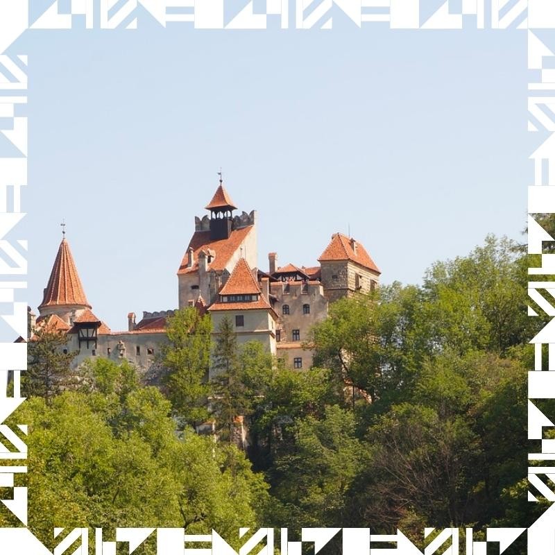 A Romanian castle in the woods, highlighting the architecture and natural setting