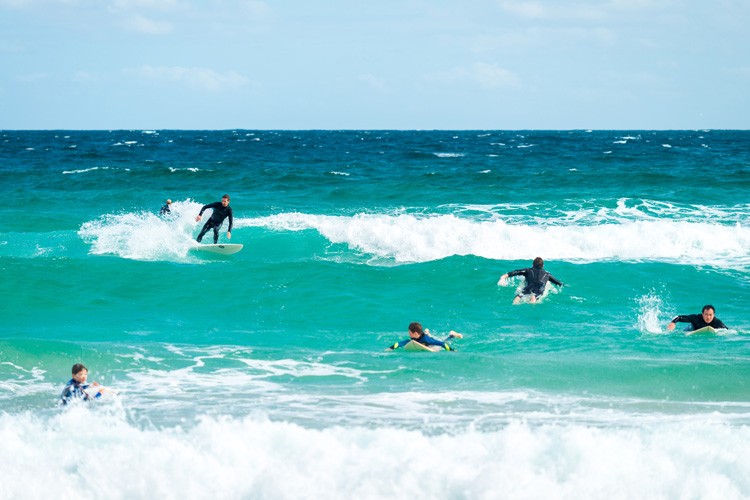Surfing beginner's journey, focusing on balance and paddle techniques