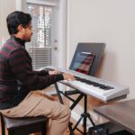 Novice piano player practicing diligently