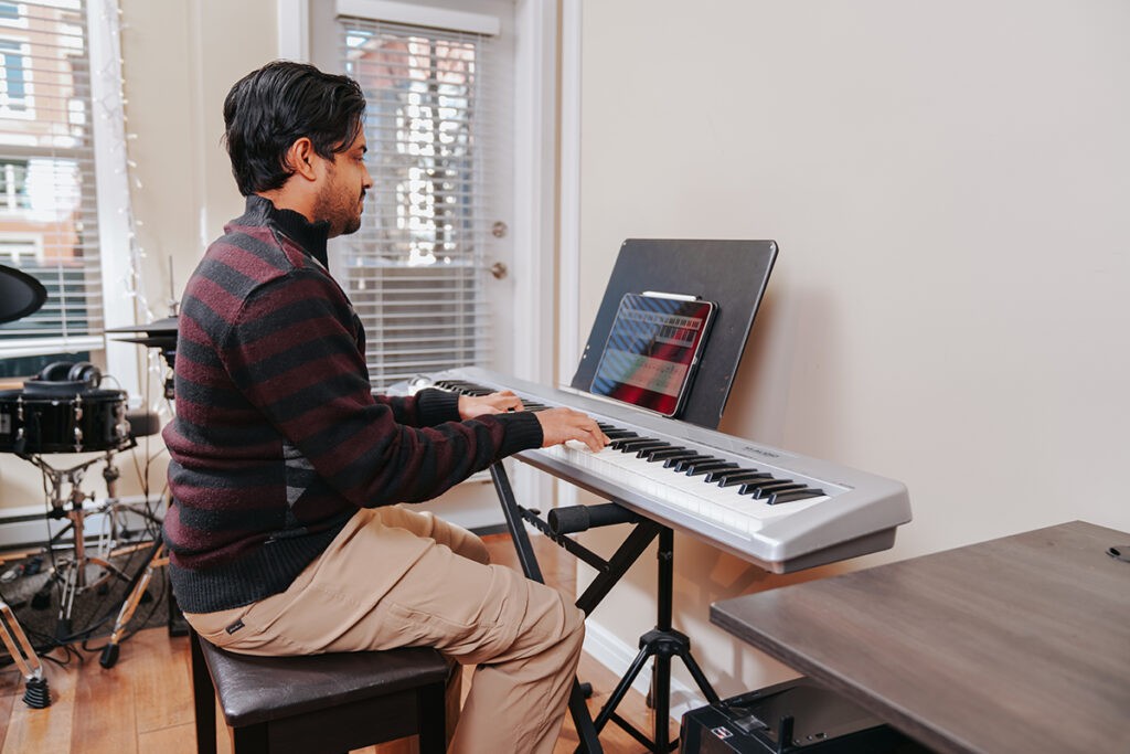Novice piano player practicing diligently