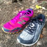 Example of a trail running shoe next to a road running shoe.