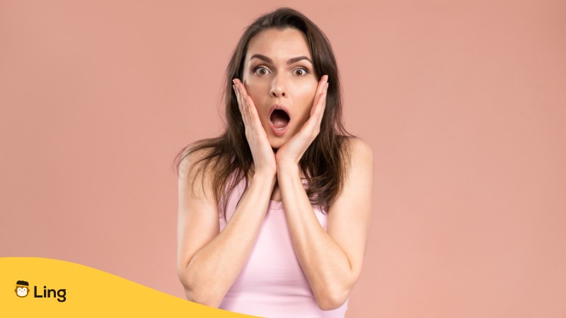 A woman holding her face, looking shocked, and mistakes in studying