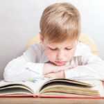 First grader reading a book