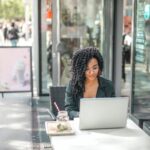 Man using laptop in a bright office. Where to Start Learning C