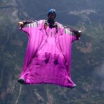 Wingsuiter flying over mountains