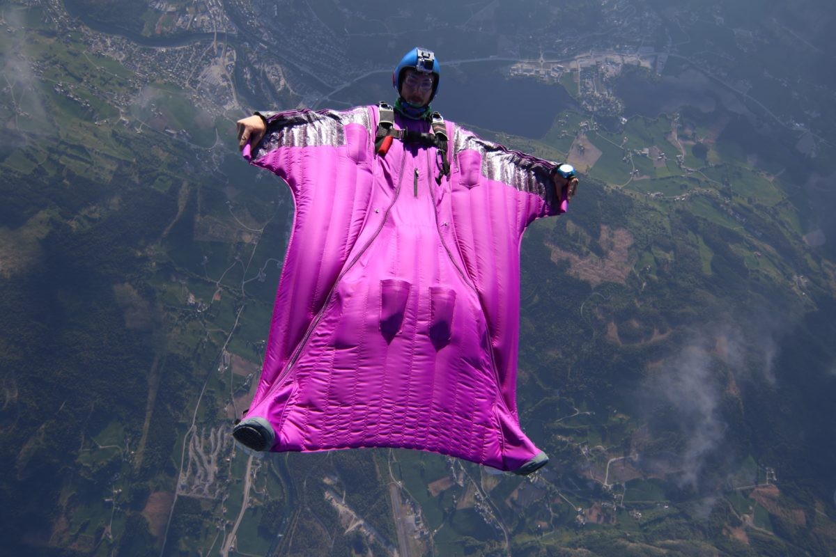 Wingsuiter flying over mountains